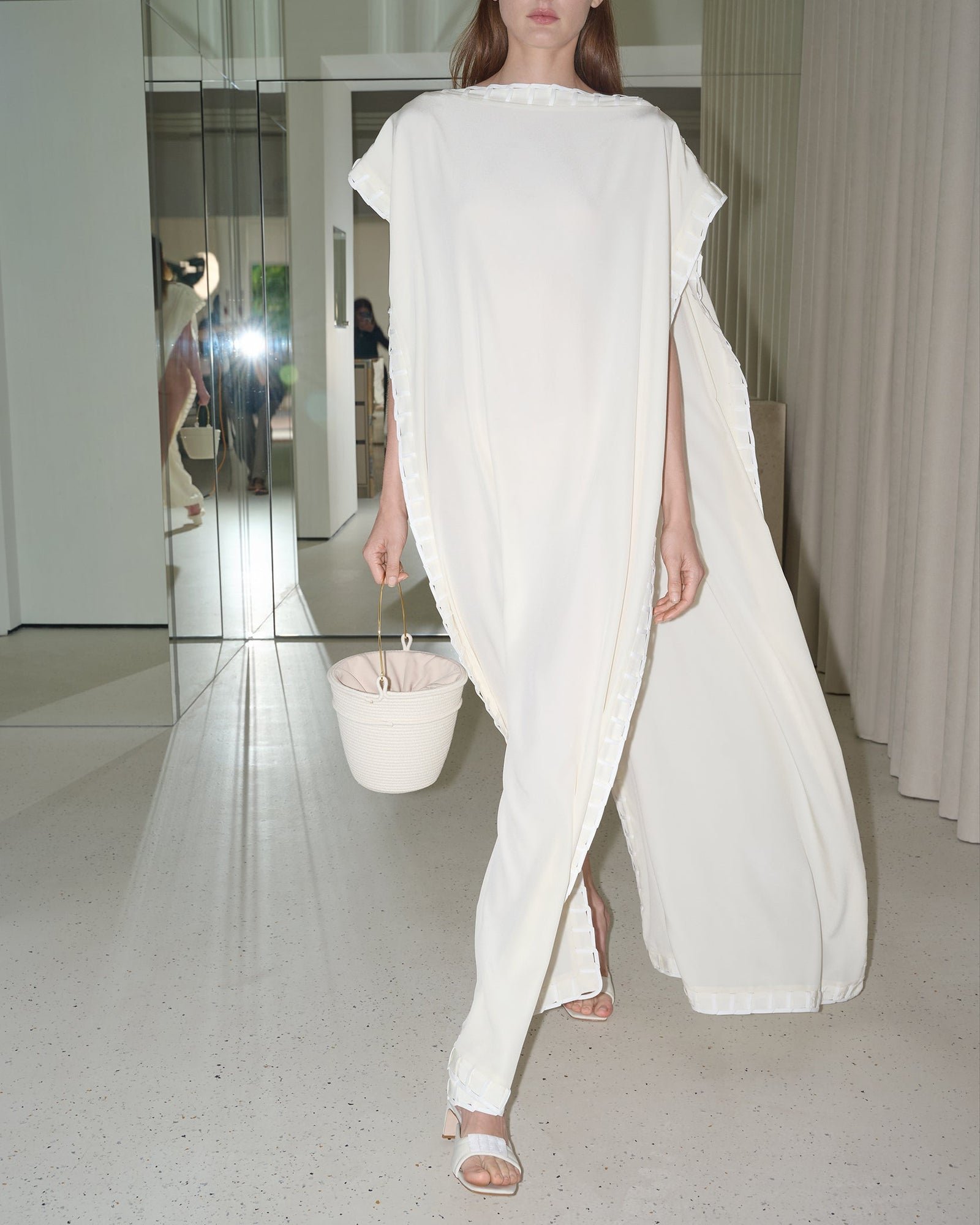 Model in the ivory BEVZA signature tunic