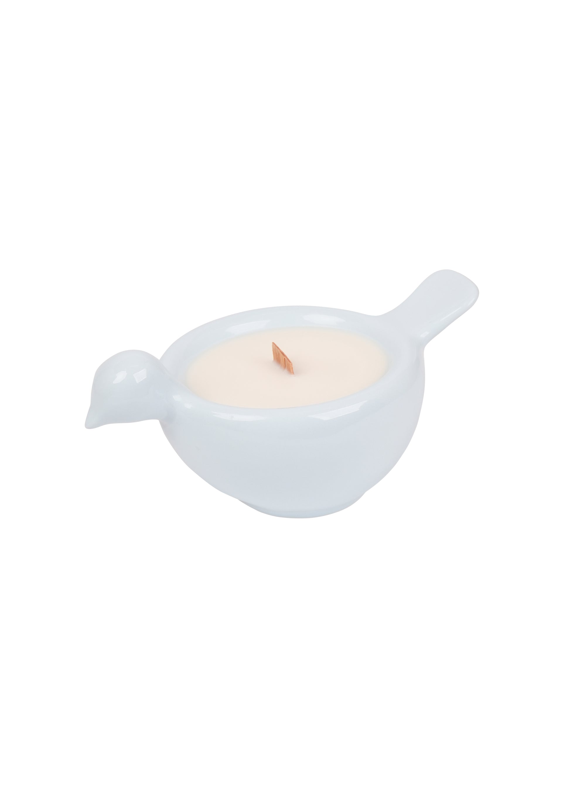 Periwinkle bird-shaped candle in a ceramic vessel